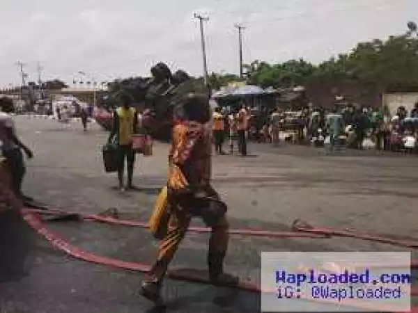 Photos: Nigerians scoop fuel from fallen petrol tanker in Abeokuta
